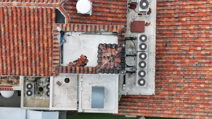 Aerial view of a row of rooftop air conditioning condensers